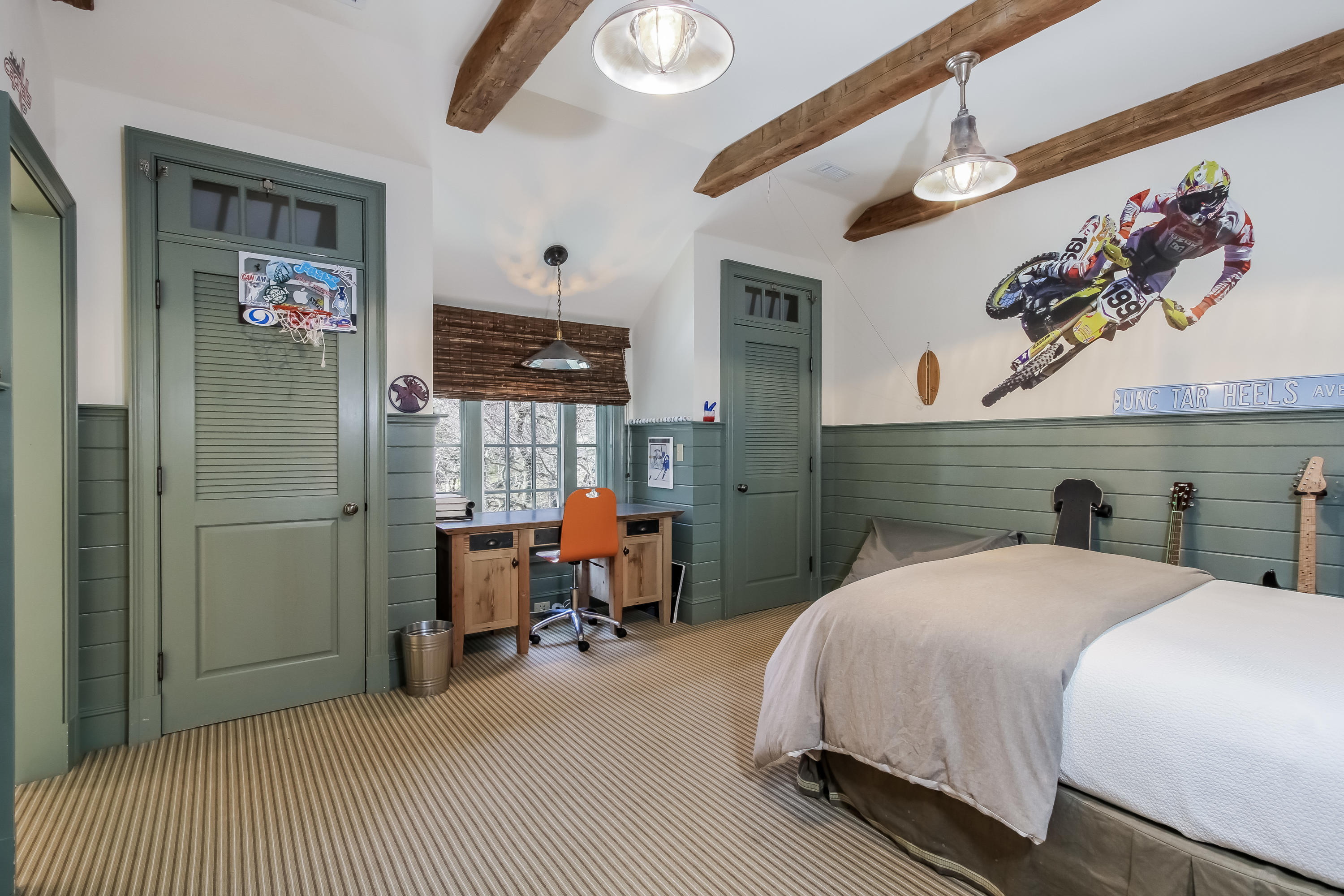 29 Sunswyck Road Darien, CT 06820 - Photo 37 of 59 a bedroom with a bed and a painting on the wall