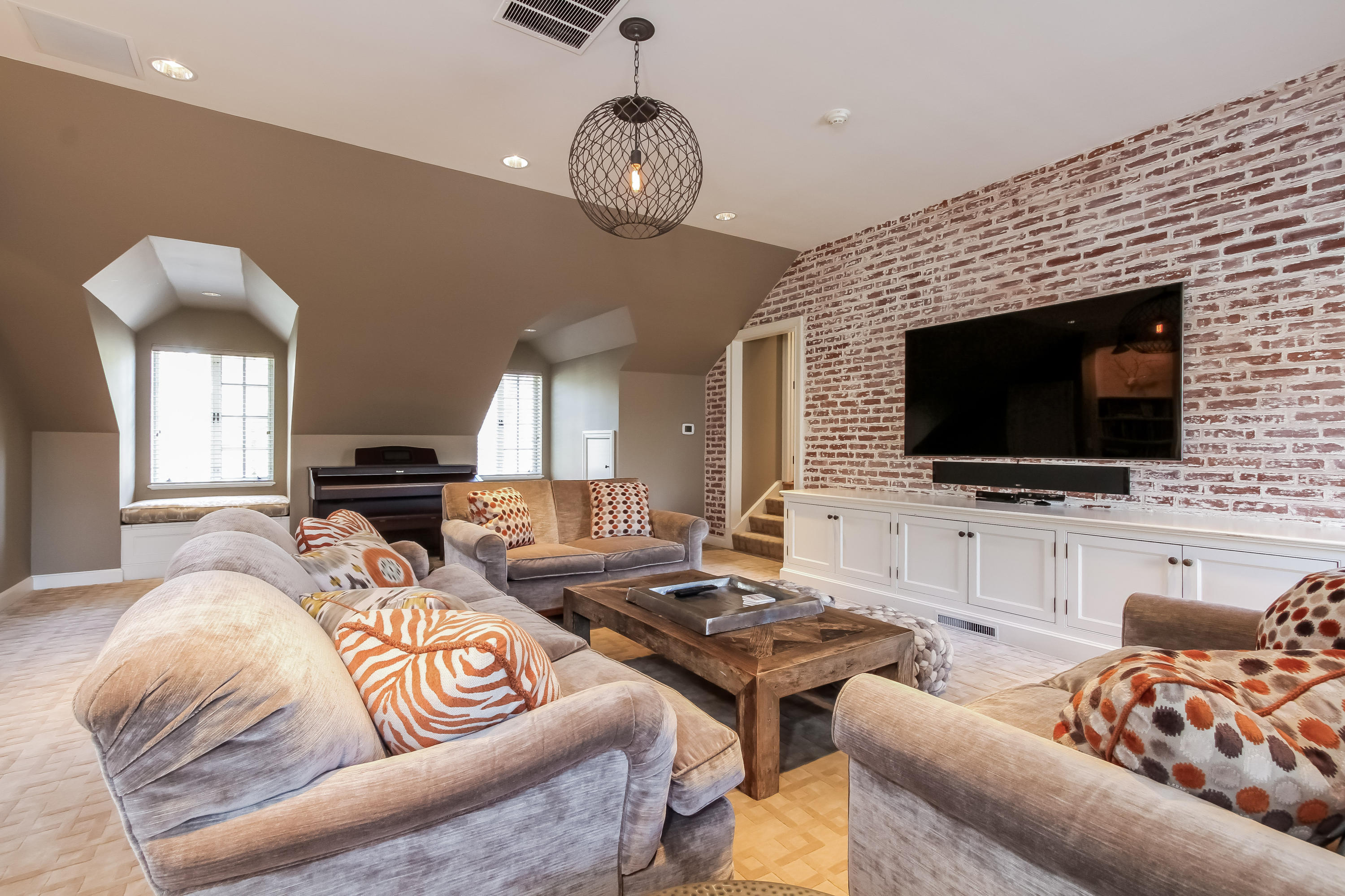 29 Sunswyck Road Darien, CT 06820 - Photo 43 of 59 a living room with furniture kitchen view and a flat screen tv