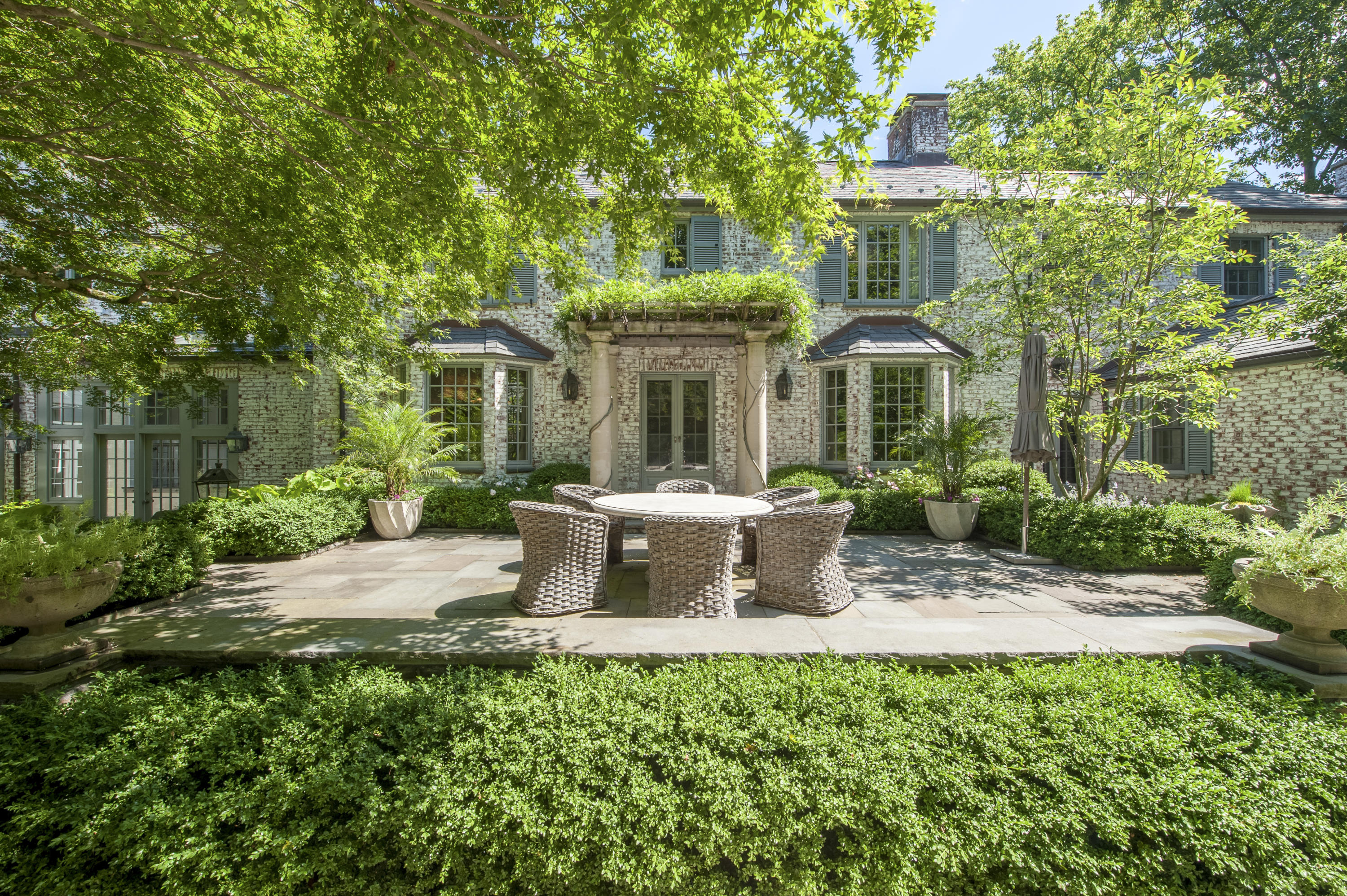 29 Sunswyck Road Darien, CT 06820 - Photo 45 of 59 a view of a house with backyard sitting area and garden