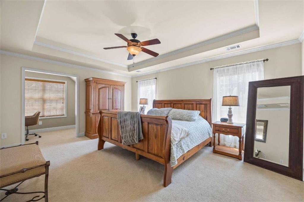42 Pintail Lane Jefferson, GA 30549 - Photo 22 of 42 a spacious bedroom with a bed and a walk in closet