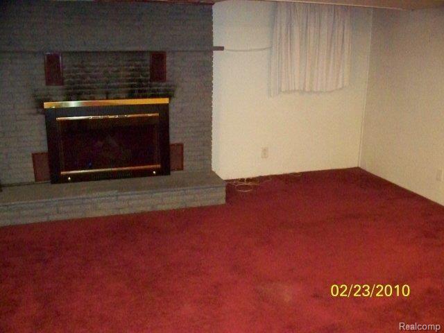 35 Cayuga Road Lake Orion, MI 48362 - Photo 8 of 12 fireplace in basement