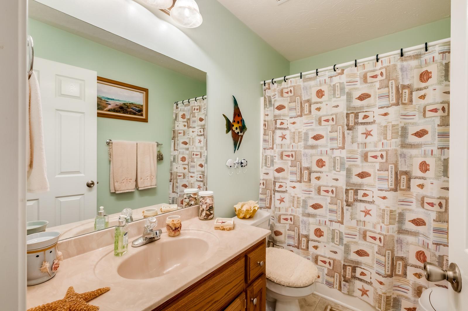 1529 Rapids Road Portland, TN 37148 - Photo 13 of 30 a bathroom with a sink toilet and shower