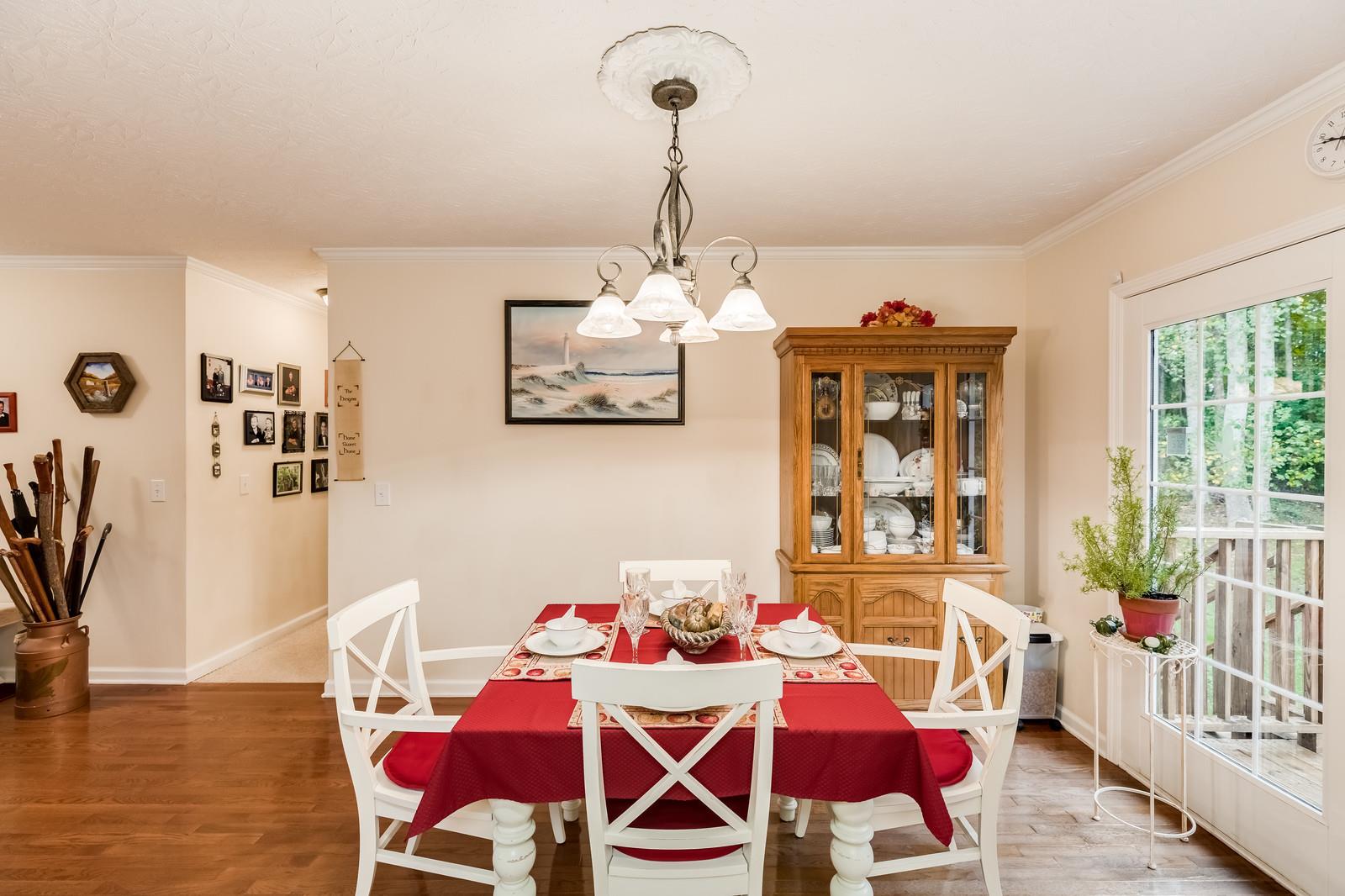1529 Rapids Road Portland, TN 37148 - Photo 20 of 30 a view of a dining room with furniture and chandelier
