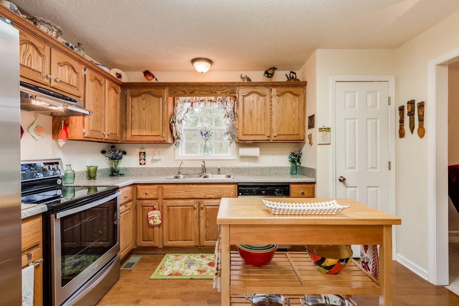1529 Rapids Road Portland, TN 37148 - Photo 23 of 30 a kitchen with stainless steel appliances a stove a sink and a refrigerator