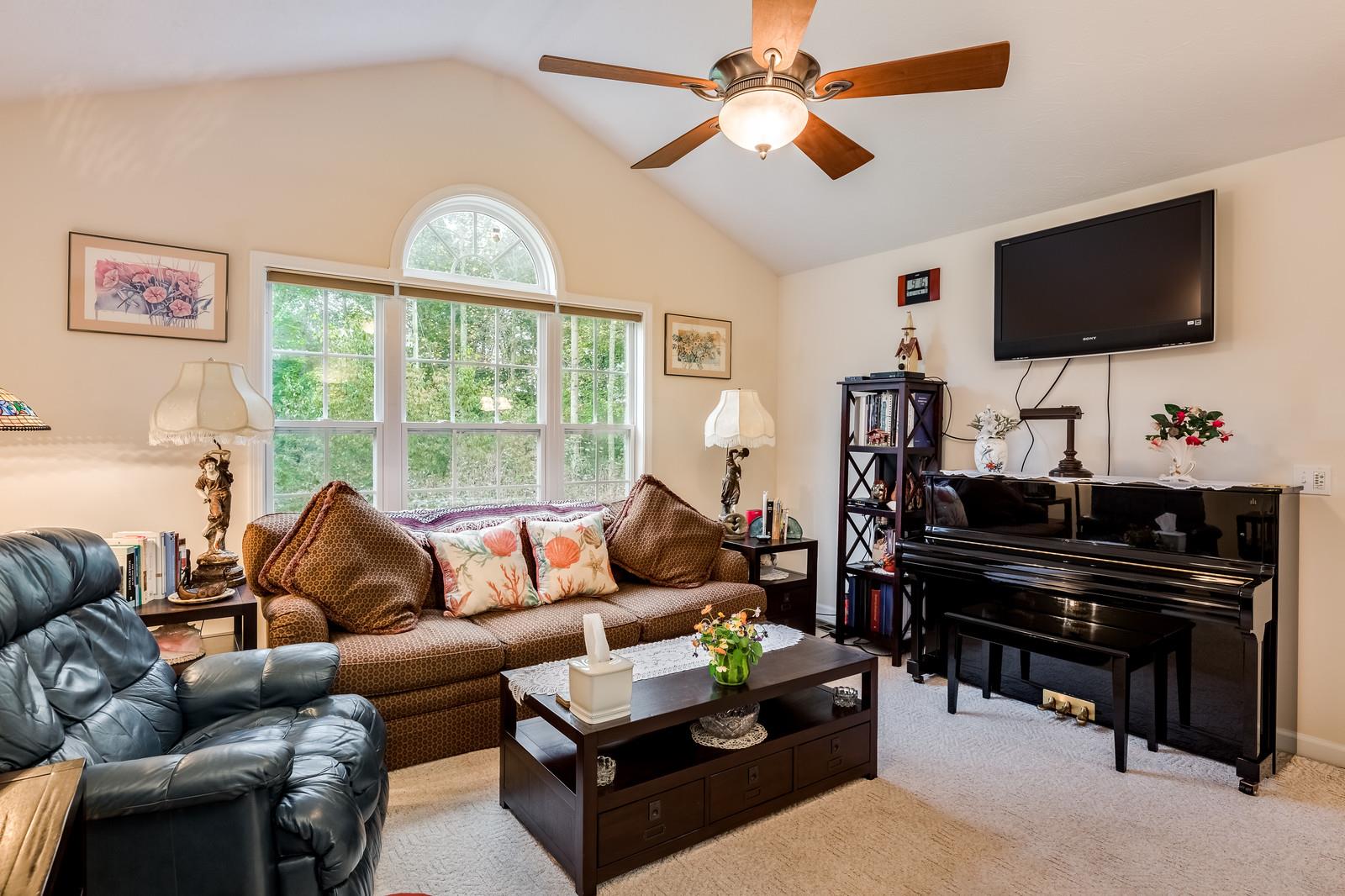 1529 Rapids Road Portland, TN 37148 - Photo 26 of 30 a living room with furniture and a flat screen tv
