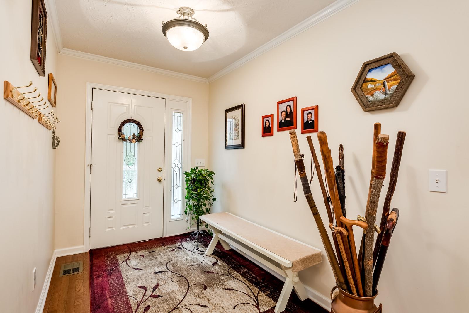 1529 Rapids Road Portland, TN 37148 - Photo 27 of 30 a view of a hallway with paintings on the wall