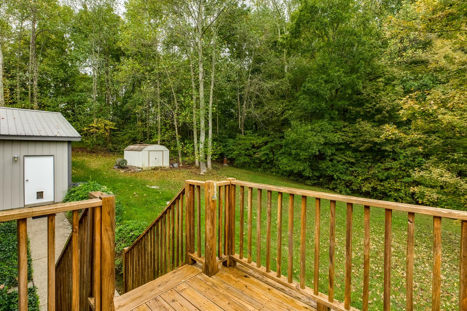 1529 Rapids Road Portland, TN 37148 - Photo 8 of 30 a view of a wooden fence and trees