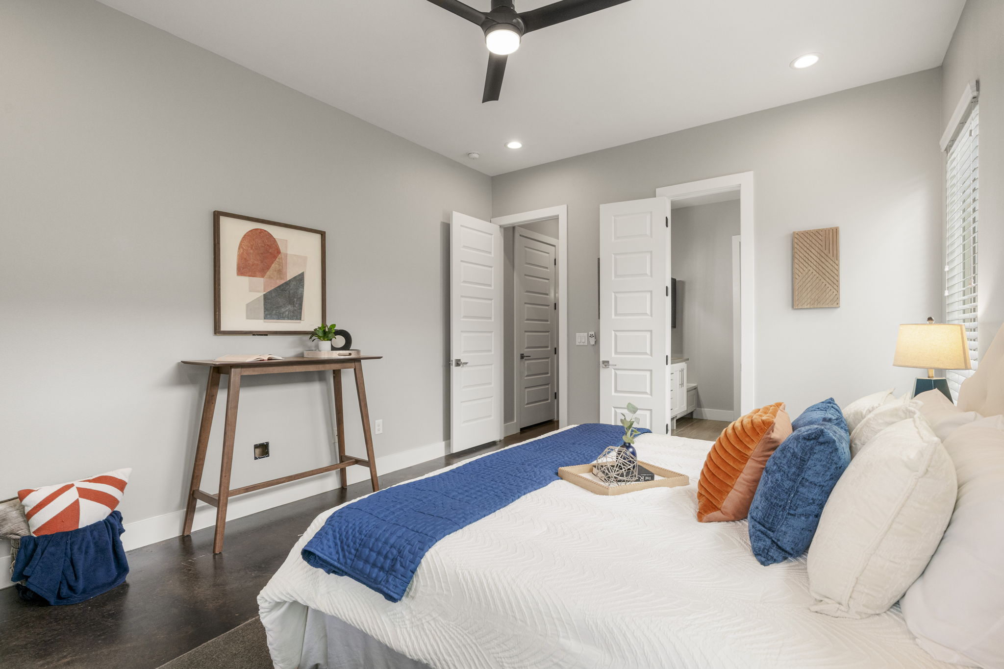 5204 Samuel Huston Avenue, Unit A Austin, TX 78721 - Photo 22 of 38 Bedroom featuring dark wood-finish flooring and light gray painted walls