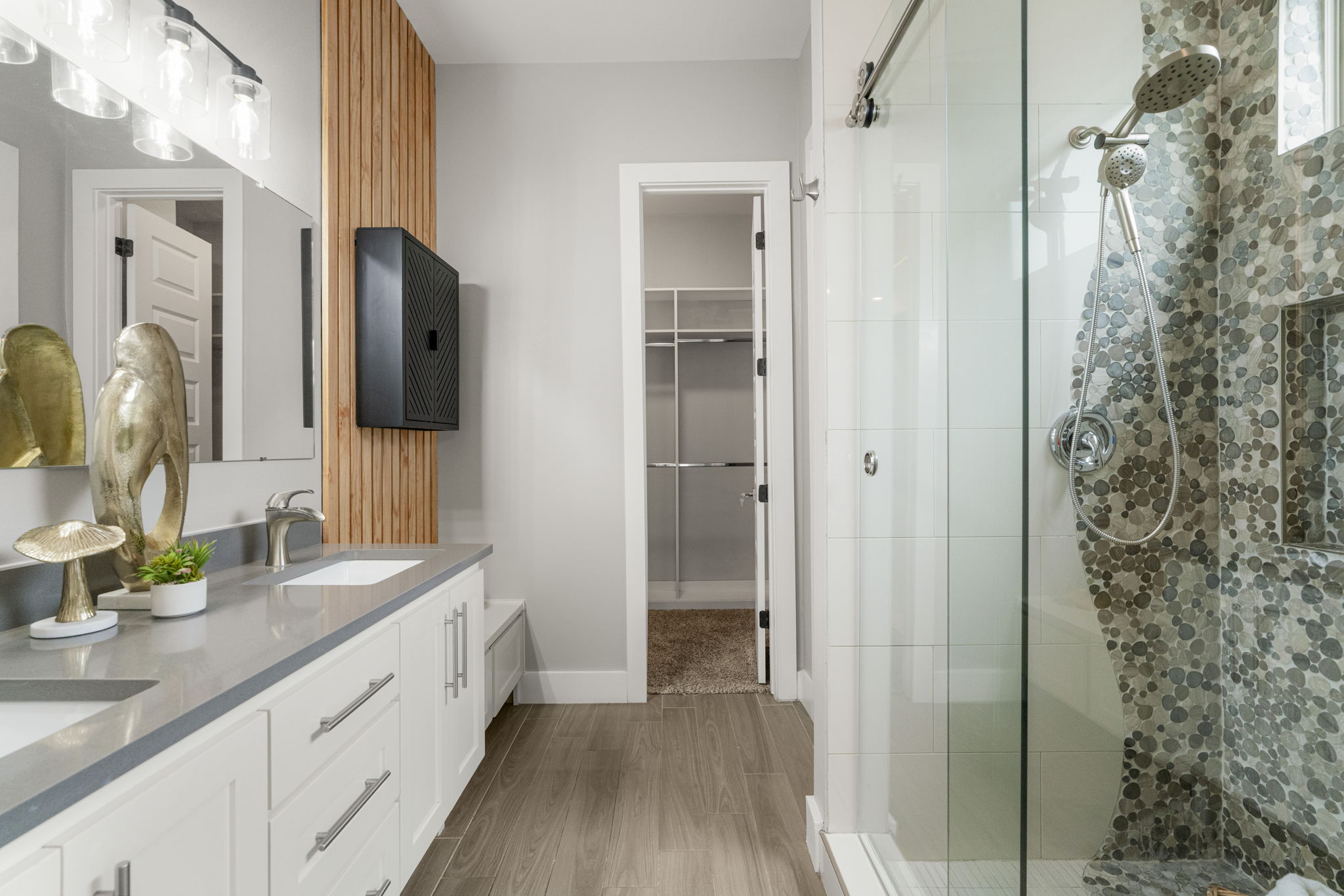 5204 Samuel Huston Avenue, Unit A Austin, TX 78721 - Photo 24 of 38 Dual vanity with white cabinetry, quartz countertop, and undermount sinks