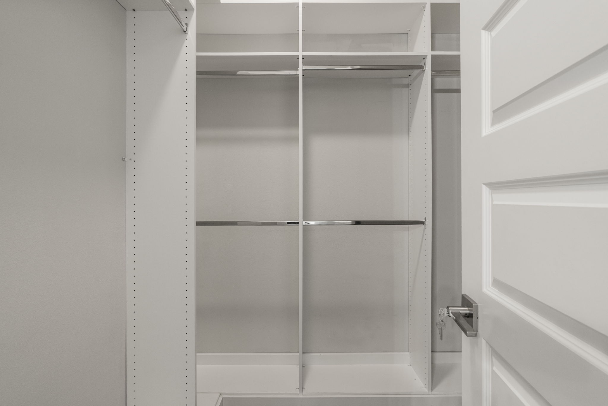 5204 Samuel Huston Avenue, Unit A Austin, TX 78721 - Photo 25 of 38 Primary custom closet organization system featuring white shelving