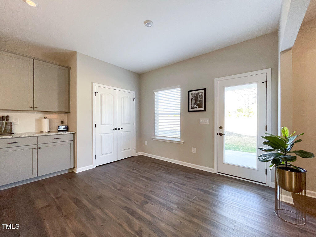 3604 Cross Timber Lane Raleigh, NC 27603 - Photo 4 of 15 a view of an empty room with window and wooden floor