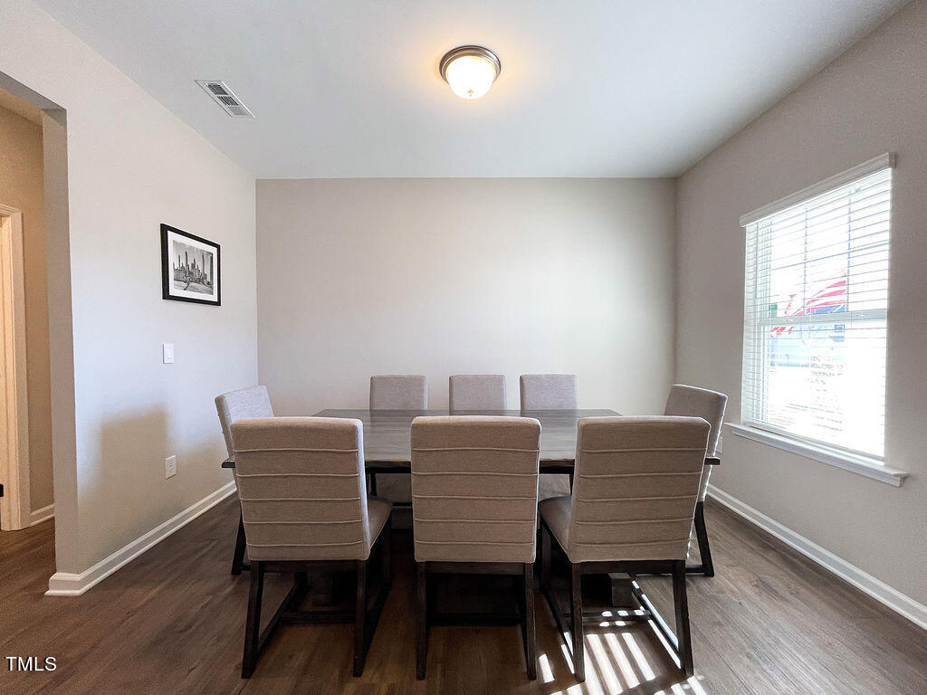 3604 Cross Timber Lane Raleigh, NC 27603 - Photo 5 of 15 a view of a dining room with furniture and wooden floor