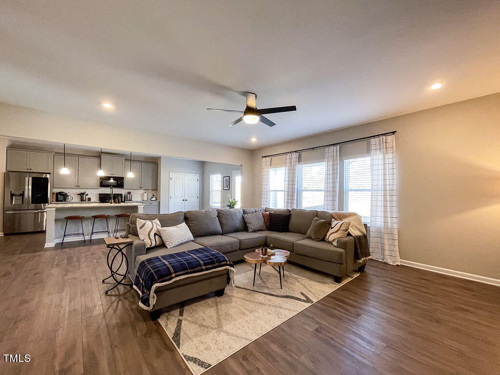 3604 Cross Timber Lane Raleigh, NC 27603 - Photo 7 of 15 a living room with furniture and a wooden floor