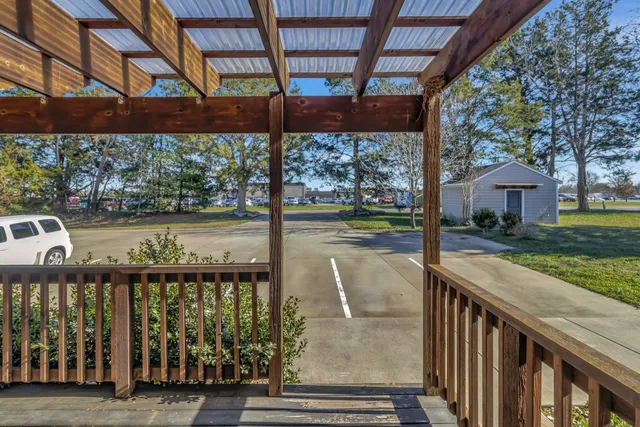 a view of balcony with wooden floor