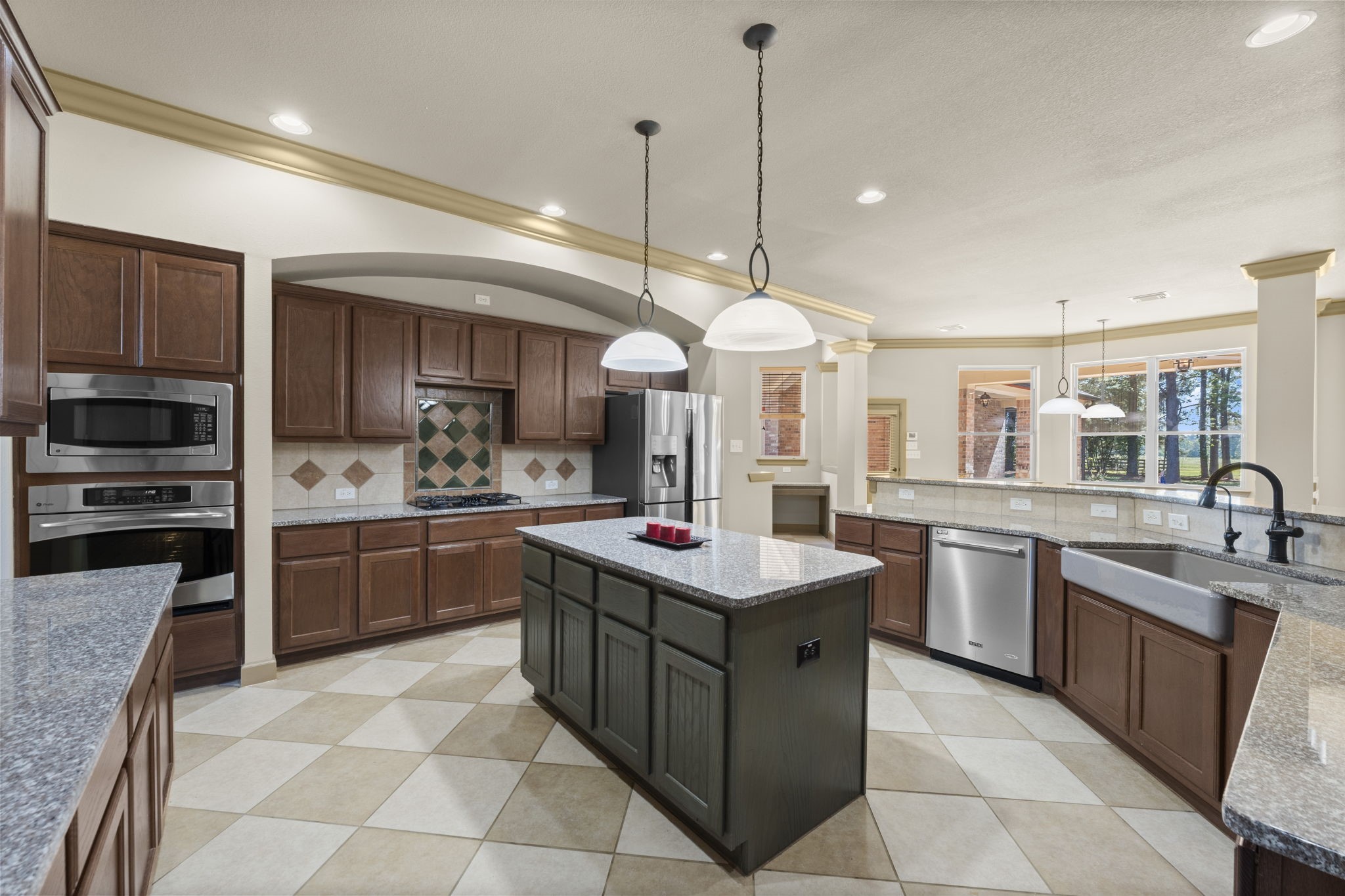 1534 Virgie Community Road Magnolia, TX 77354 - Photo 25 of 50 An expansive kitchen featuring gorgeous granite counter tops, thoughtfully designed for effortless entertaining with family and friends.