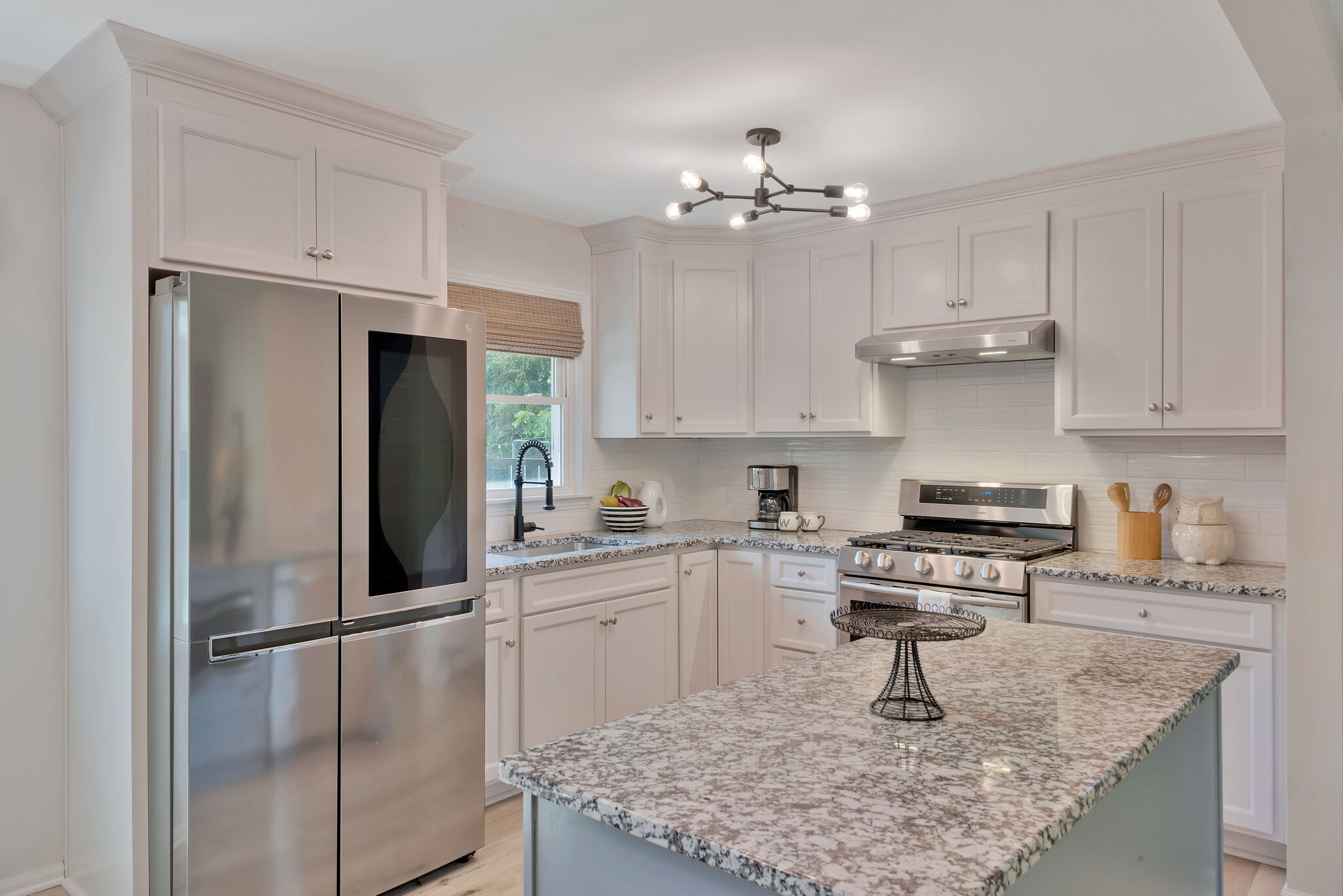 212 Pump Hill Road Dickson, TN 37055 - Photo 11 of 27 a kitchen with kitchen island granite countertop stainless steel appliances a sink stove and refrigerator