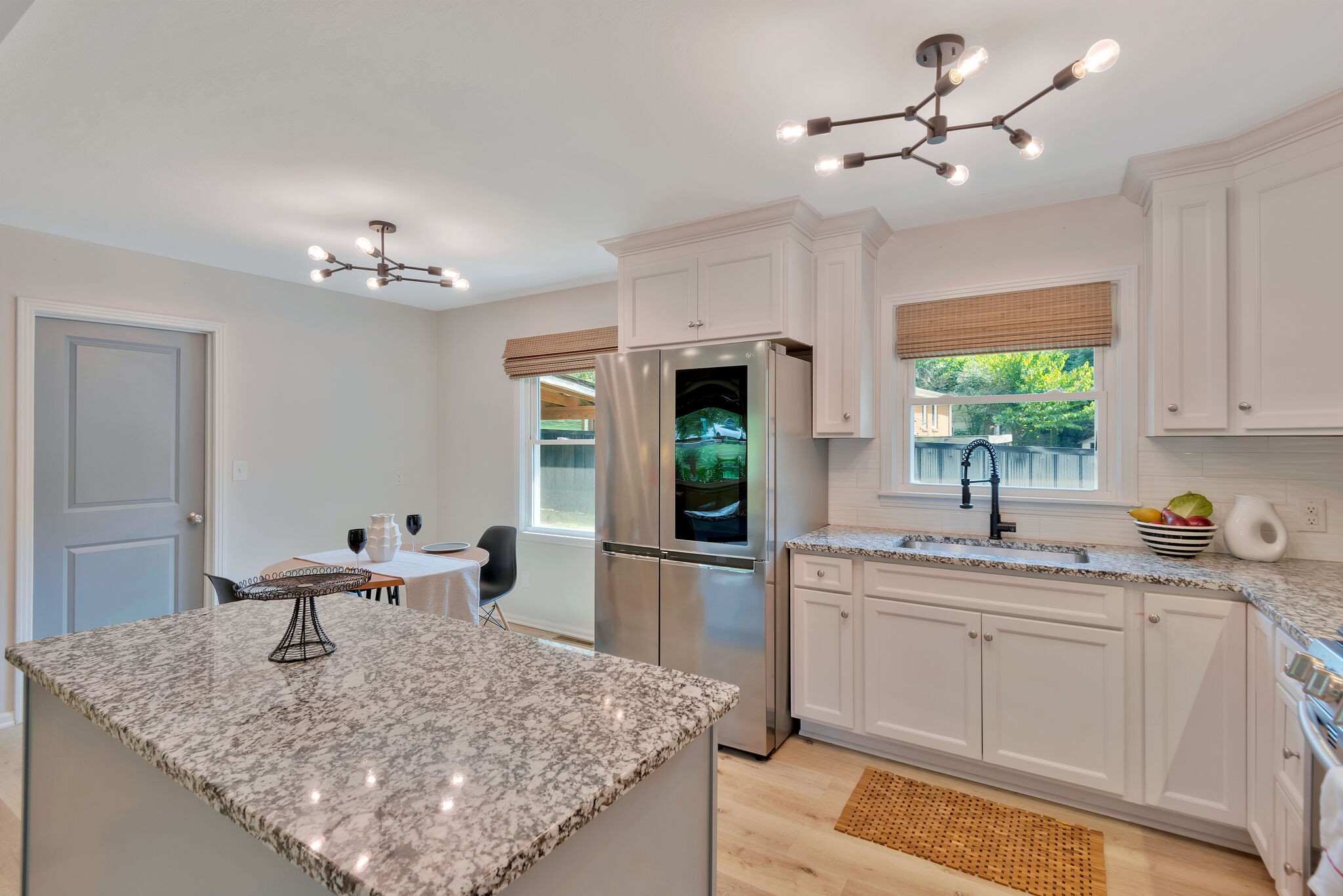 212 Pump Hill Road Dickson, TN 37055 - Photo 13 of 27 a kitchen with stainless steel appliances granite countertop a sink a stove and a window