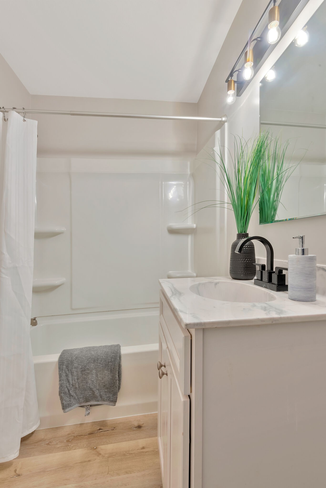 212 Pump Hill Road Dickson, TN 37055 - Photo 23 of 27 a bathroom with a sink a potted plant and a shower