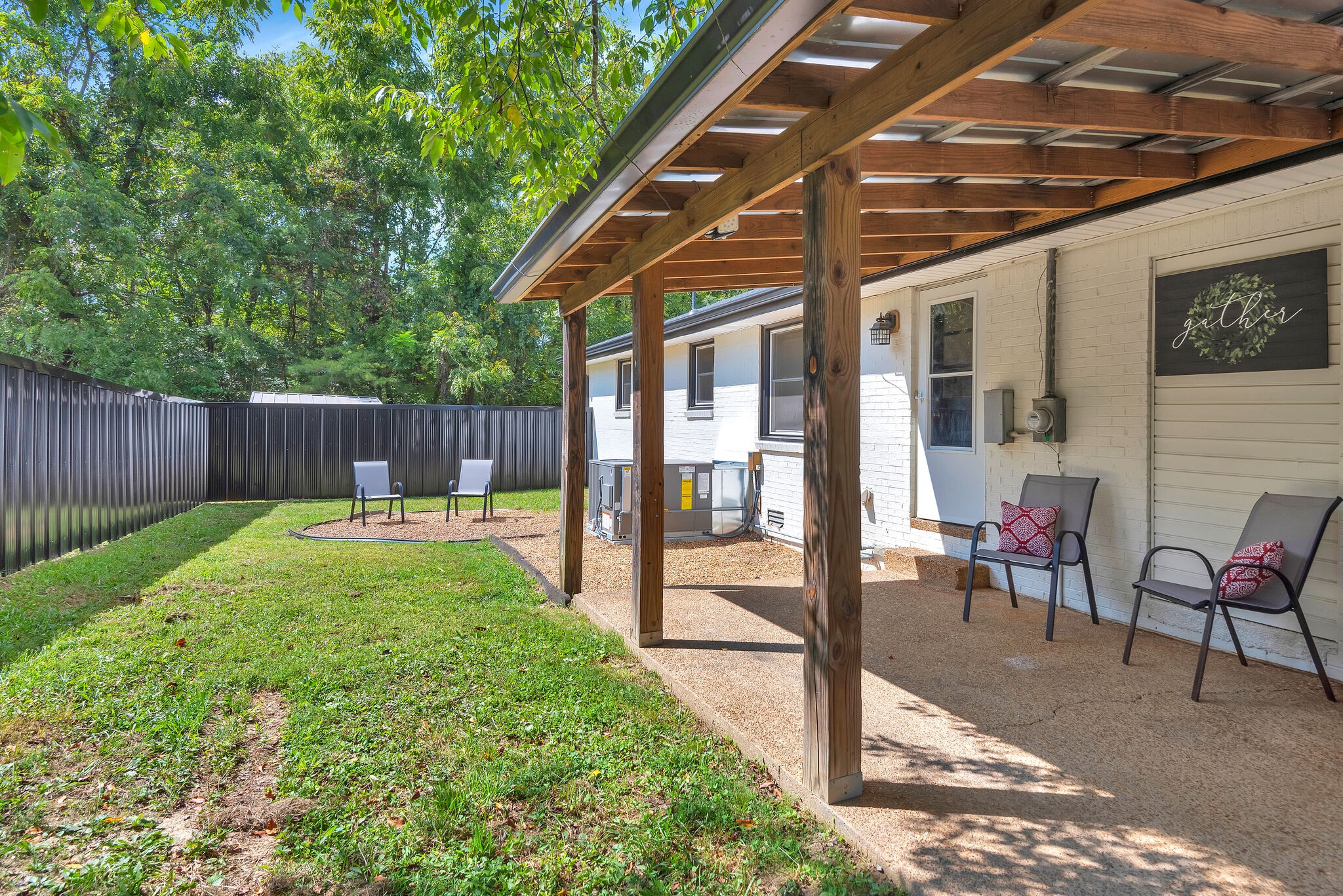 212 Pump Hill Road Dickson, TN 37055 - Photo 24 of 27 a view of a backyard with a patio and a garden