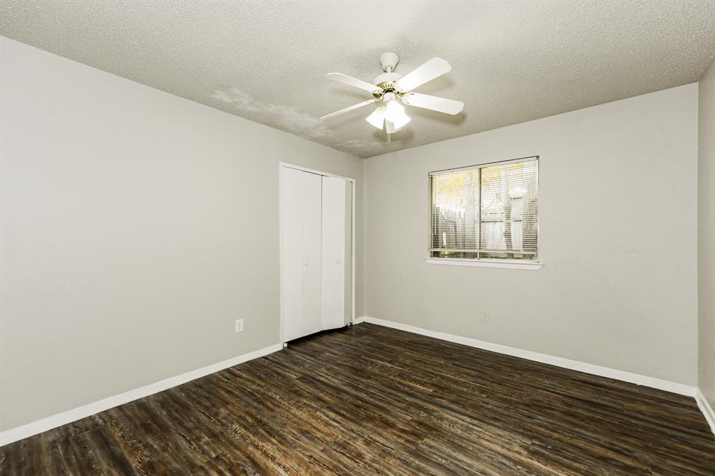 218 Long Shadow Lane Mesquite, TX 75149 - Photo 11 of 15 a view of an empty room with wooden floor and a window