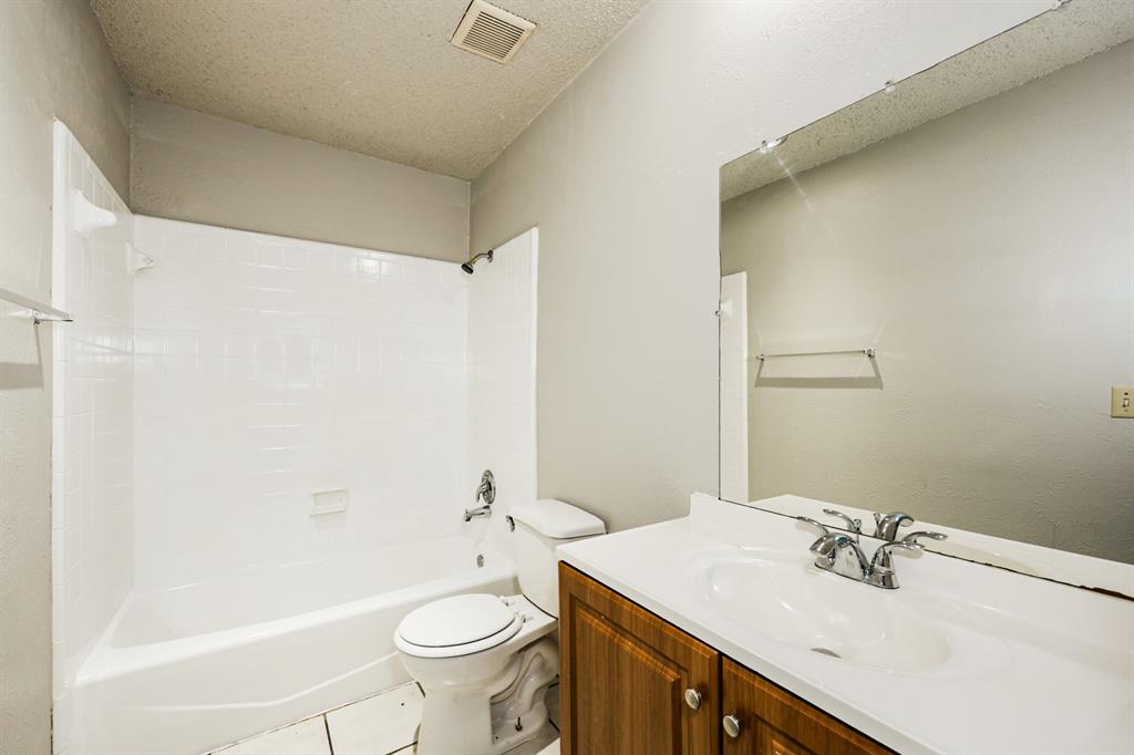 218 Long Shadow Lane Mesquite, TX 75149 - Photo 12 of 15 a bathroom with a sink a toilet and shower