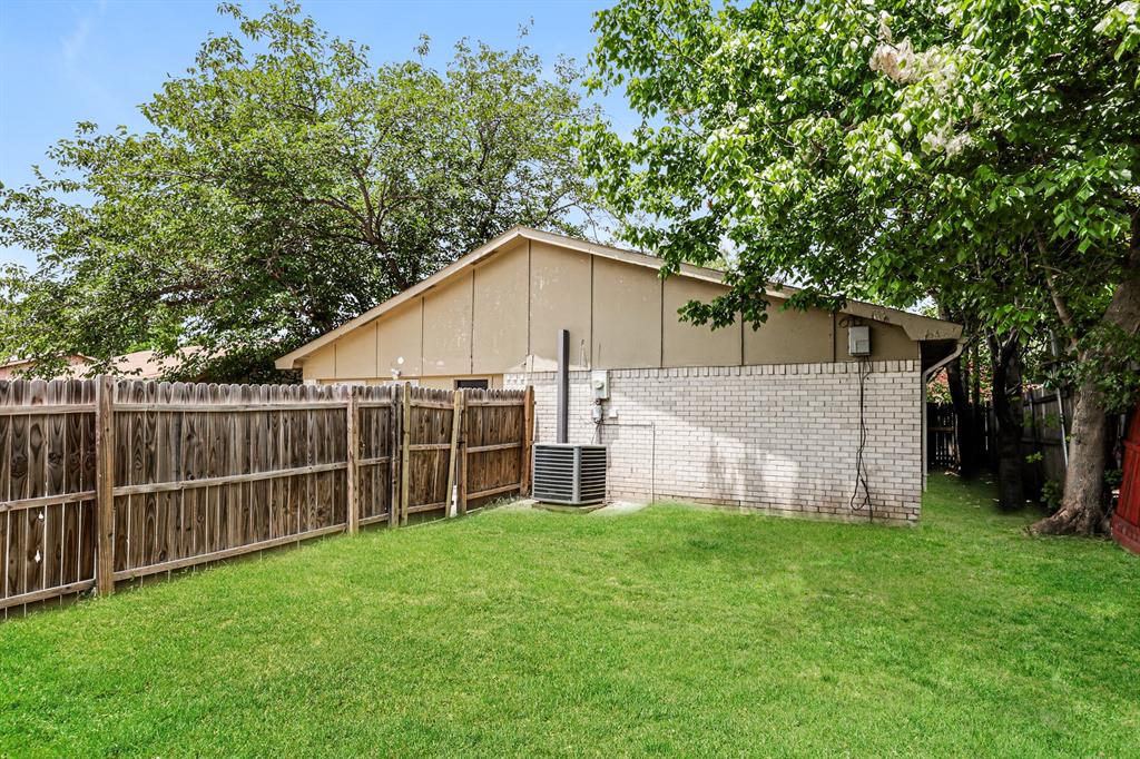 218 Long Shadow Lane Mesquite, TX 75149 - Photo 15 of 15 a view of a small house with a big yard and large trees