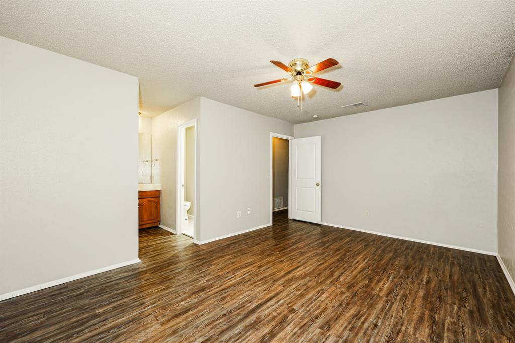 218 Long Shadow Lane Mesquite, TX 75149 - Photo 8 of 15 a view of an empty room with window and wooden floor