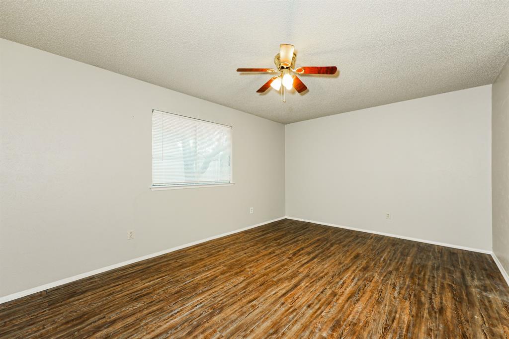 218 Long Shadow Lane Mesquite, TX 75149 - Photo 9 of 15 a view of a room with wooden floor and a fan