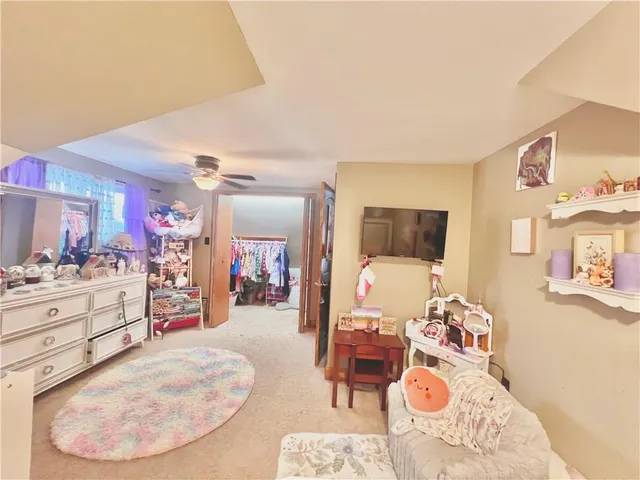 a view of a livingroom and dining room and wooden floor