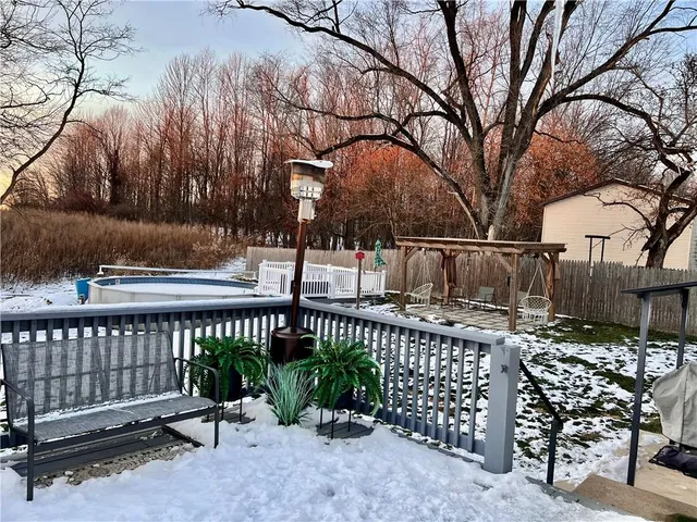 a view of a bench with iron fence