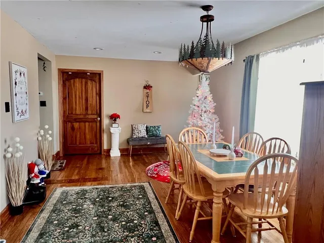 a table room with furniture and a chandelier