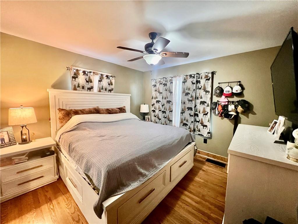 929 Mt Jackson Road New Castle, PA 16102 - Photo 10 of 21 a bedroom with a bed and a flat tv screen on dresser