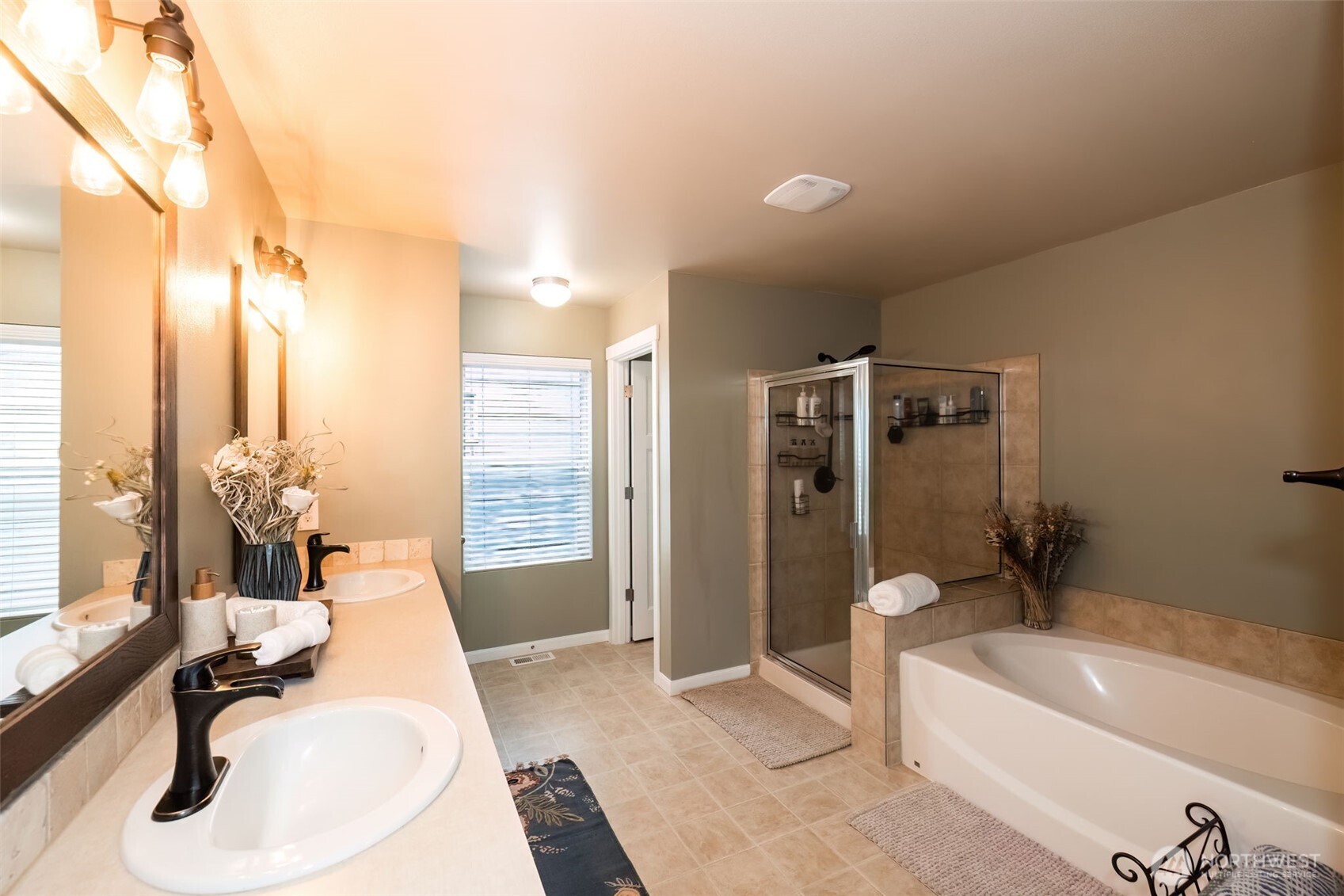 4189 Southwest Colbert Way Port Orchard, WA 98367 - Photo 22 of 38 a bathroom with a tub sink and mirror