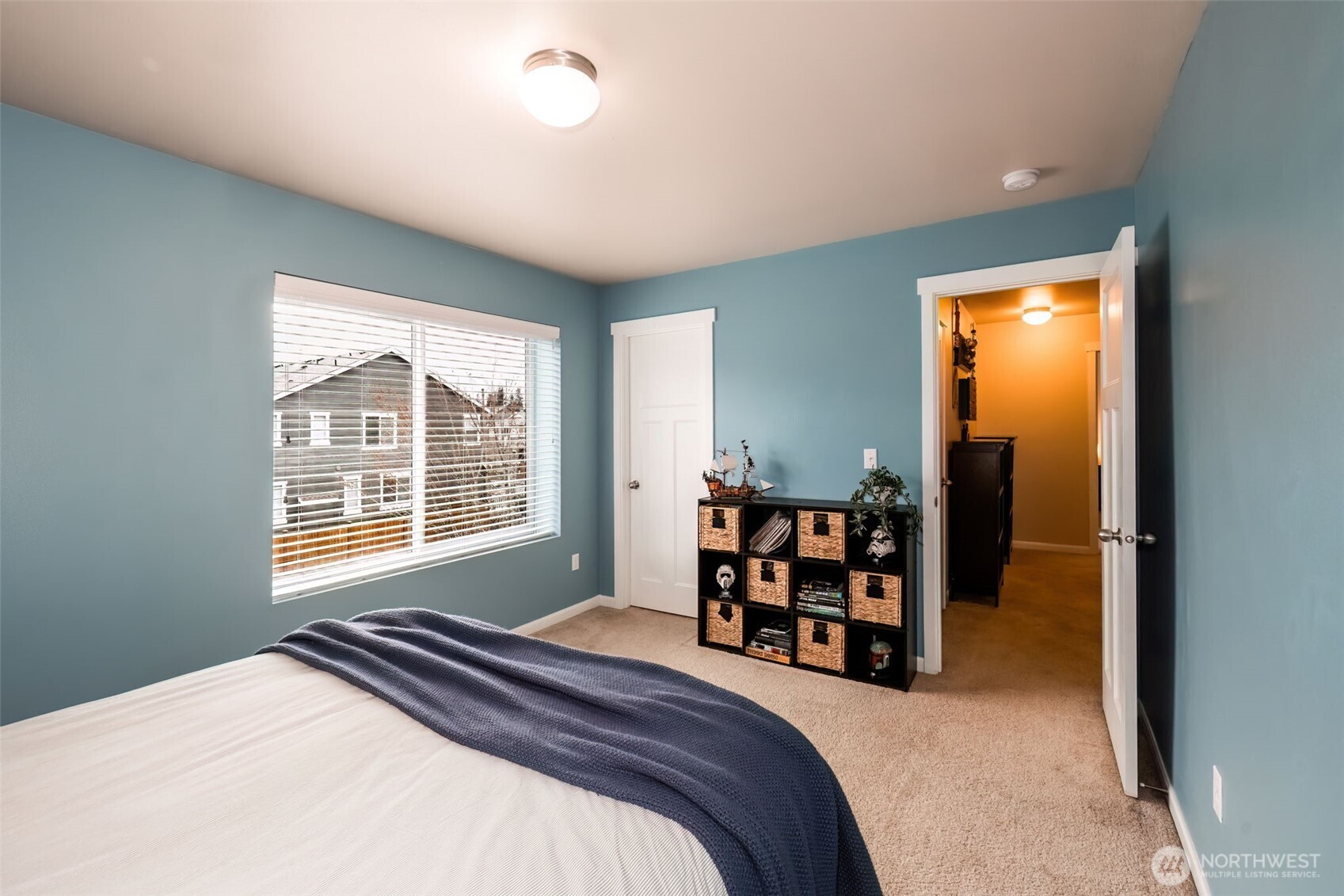 4189 Southwest Colbert Way Port Orchard, WA 98367 - Photo 26 of 38 a bedroom with a bed and a large window
