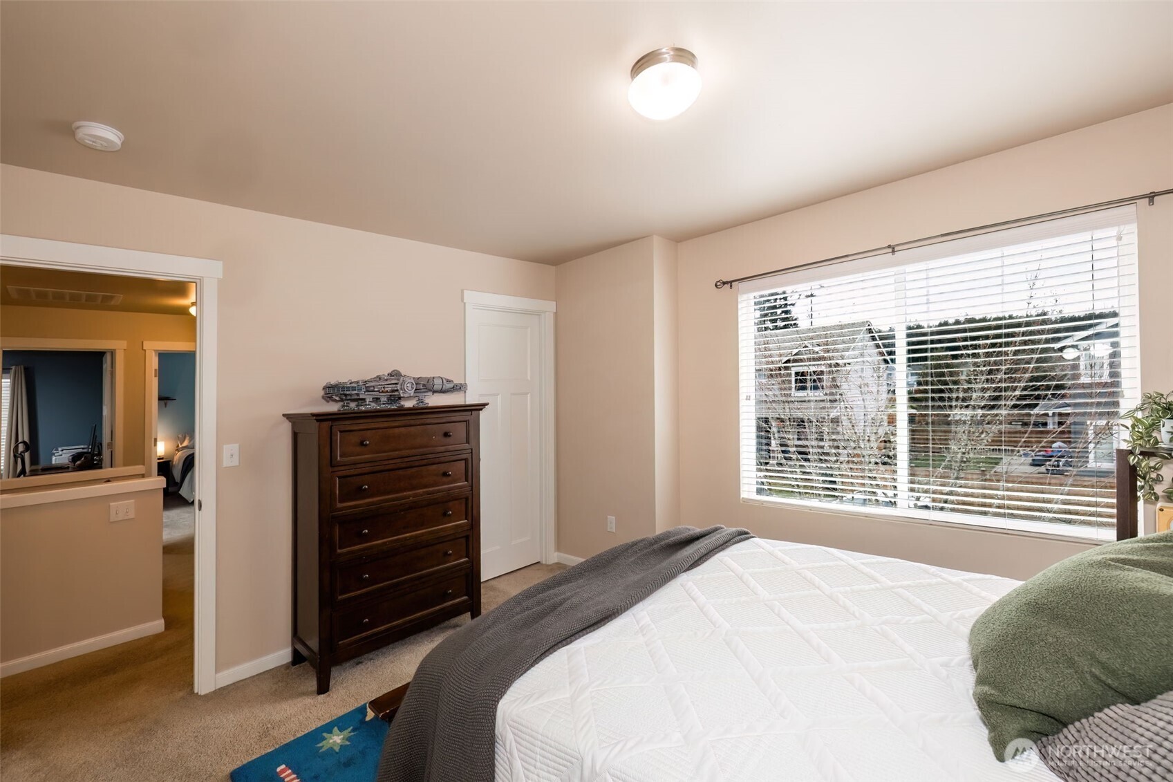 4189 Southwest Colbert Way Port Orchard, WA 98367 - Photo 28 of 38 a bedroom with a bed and a window