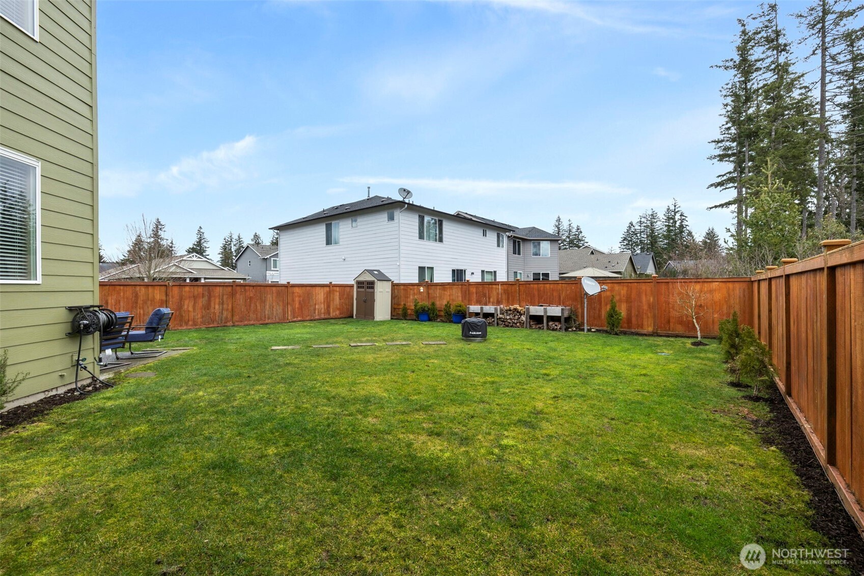 4189 Southwest Colbert Way Port Orchard, WA 98367 - Photo 34 of 38 a view of backyard with barbeque oven and wooden fence