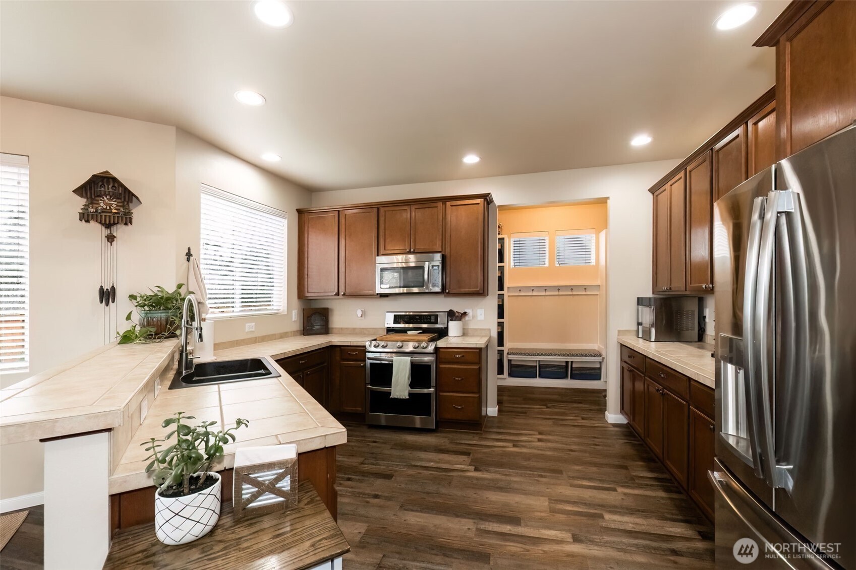 4189 Southwest Colbert Way Port Orchard, WA 98367 - Photo 10 of 38 a kitchen with counter top space appliances and wooden floor