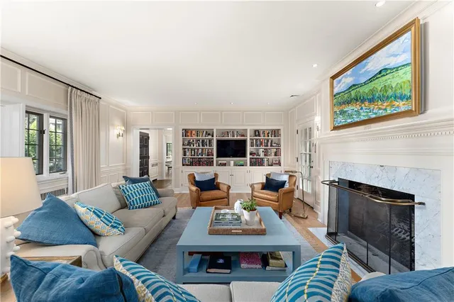 a living room with furniture and a fireplace