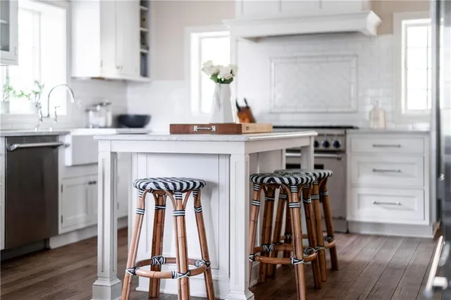 a kitchen with a sink and cabinets