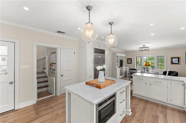 a kitchen with a stove a sink and a refrigerator