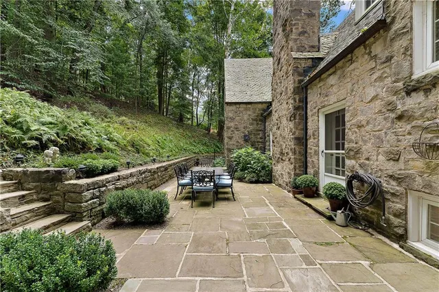 a view of a terrace with furniture and garden
