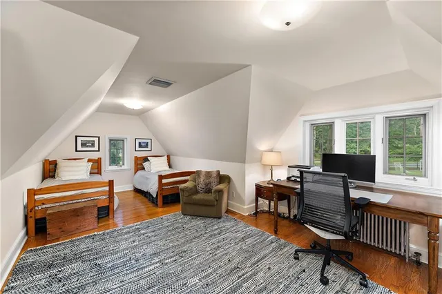 a living room with furniture a rug and a window