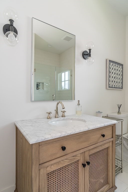 274 Manning Street Needham, MA 02492 - Photo 12 of 26 a bathroom with a sink vanity and a mirror