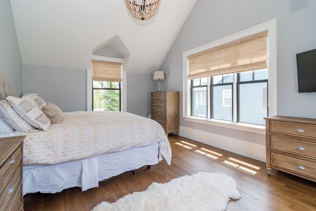 274 Manning Street Needham, MA 02492 - Photo 14 of 26 a spacious bedroom with a bed and a large window