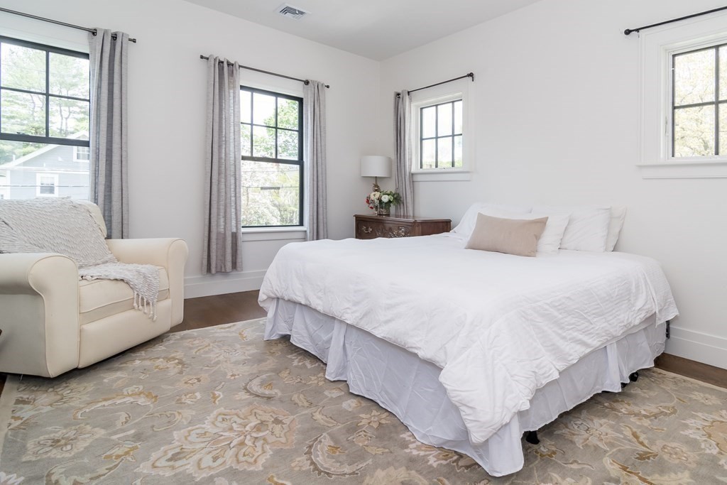 274 Manning Street Needham, MA 02492 - Photo 18 of 26 a bedroom with a bed couch and windows