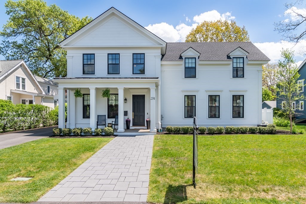 274 Manning Street Needham, MA 02492 - Photo 2 of 26 a front view of a house with a yard