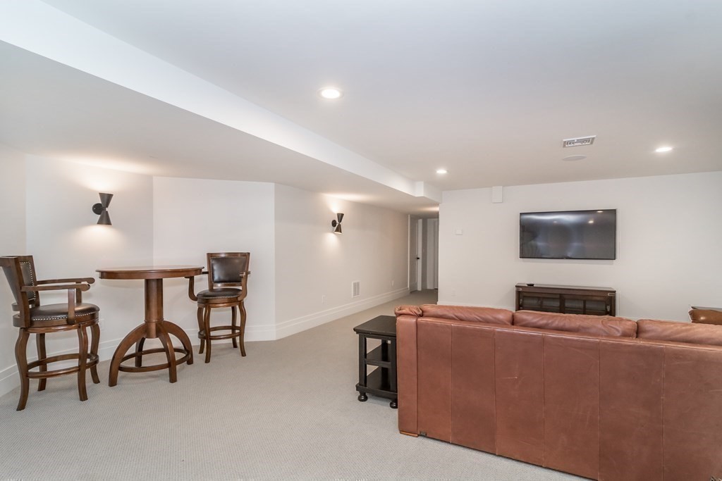274 Manning Street Needham, MA 02492 - Photo 23 of 26 a living room with furniture and a flat screen tv