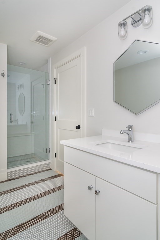 274 Manning Street Needham, MA 02492 - Photo 25 of 26 a bathroom with a sink a toilet and shower