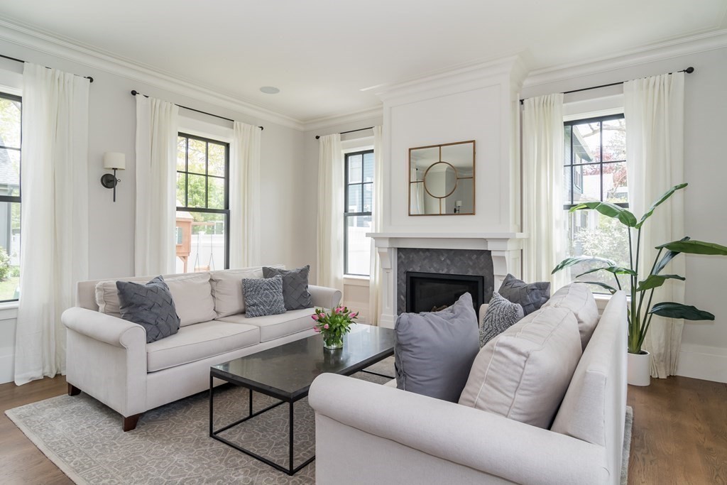 274 Manning Street Needham, MA 02492 - Photo 3 of 26 a living room with furniture and a fireplace