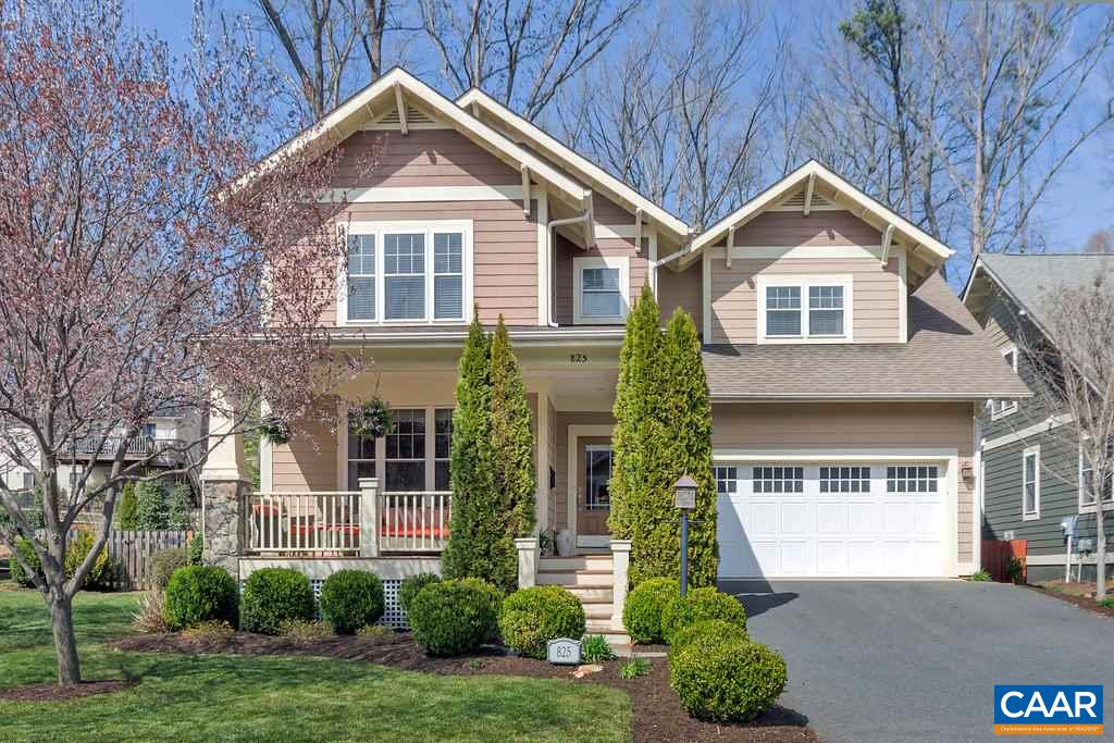 825 Village Road Charlottesville, VA 22903 - Photo 1 of 42 a front view of a house with a yard and garage